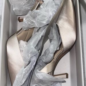 Champagne sling pumps.